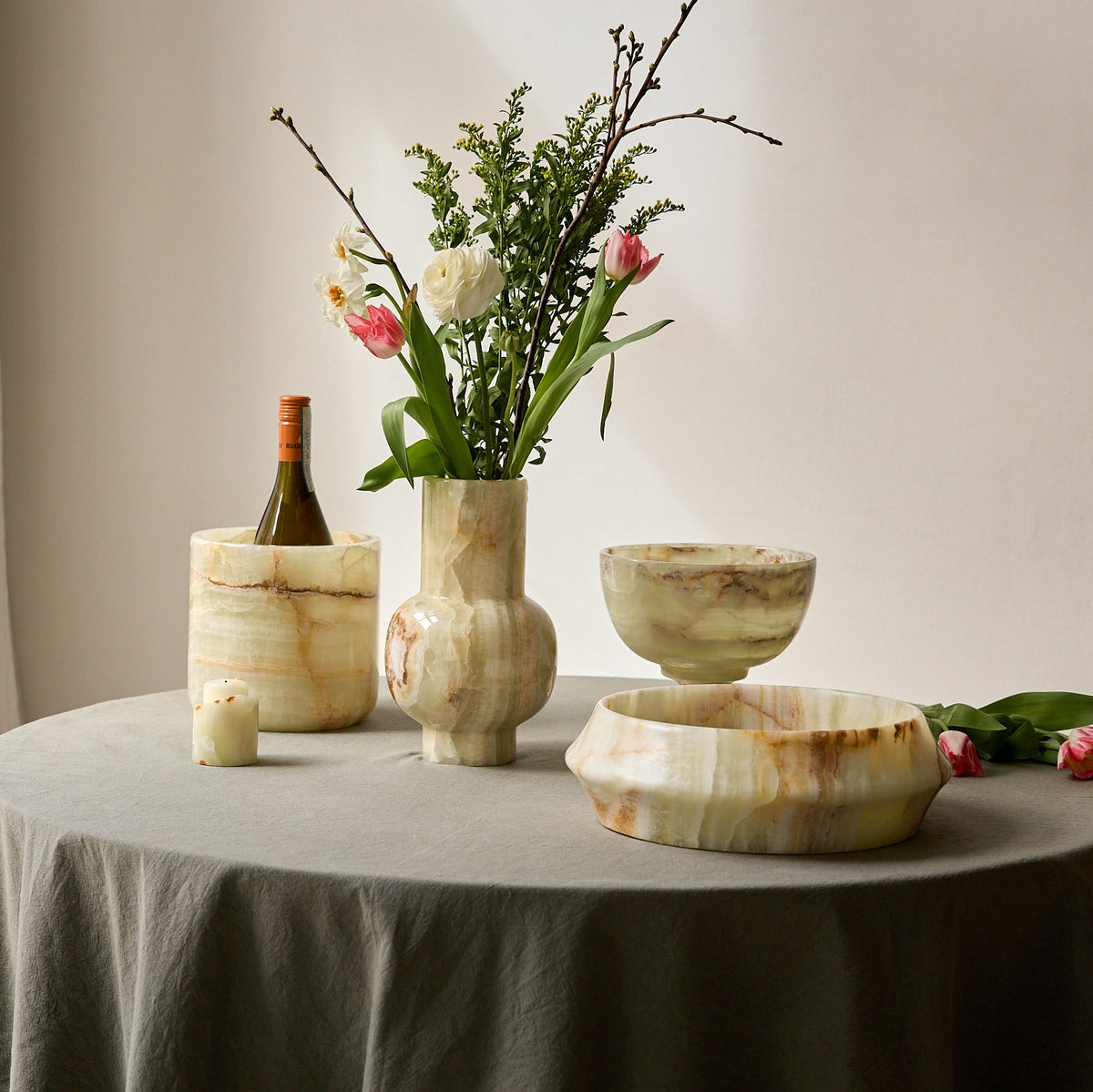 Elegantly decorated dining table with s a set of onyx home accessories by uniiqo studio