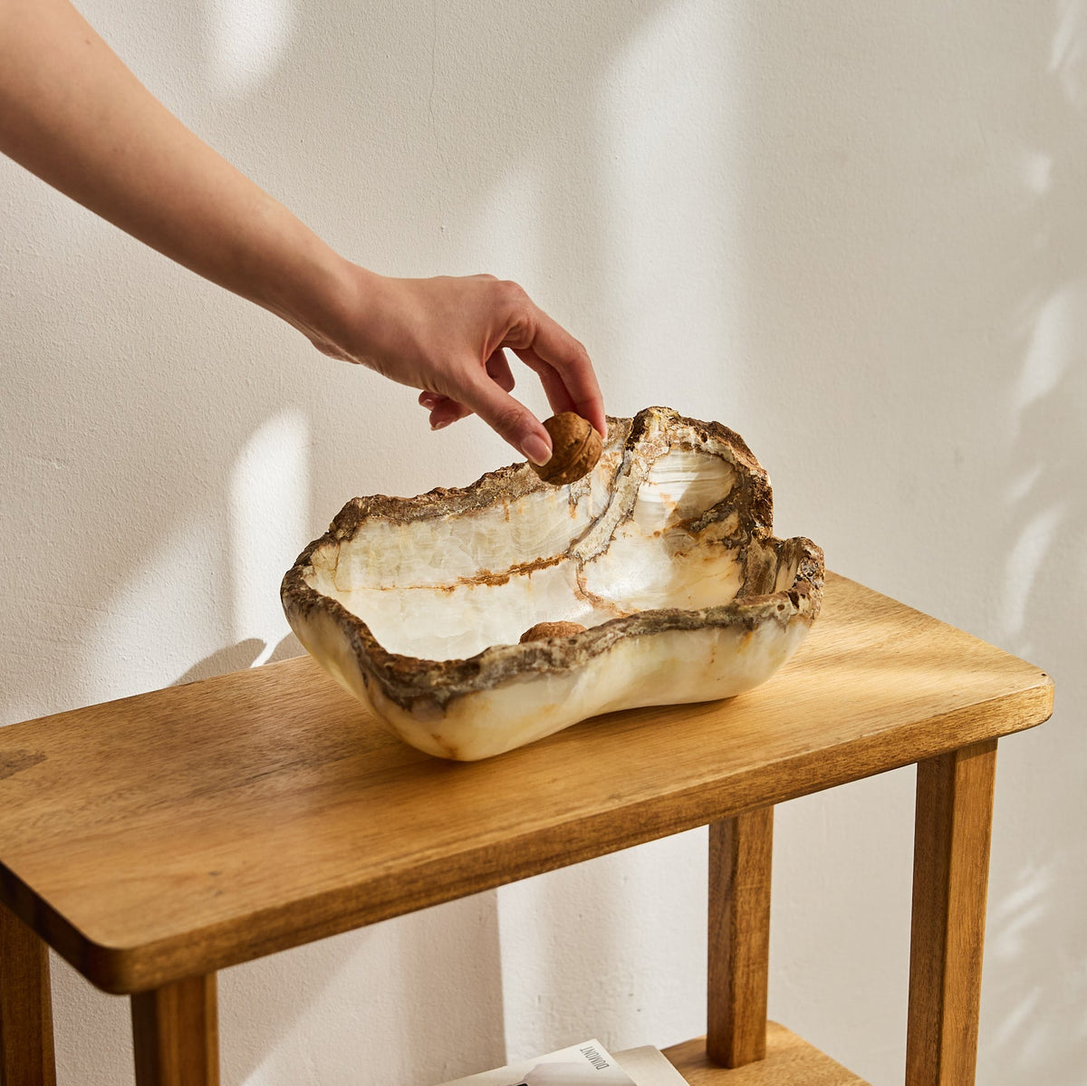 Rough onyx bowl with raw edges and ivory color.