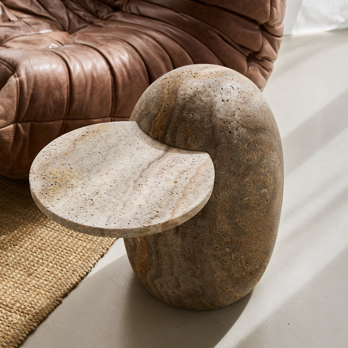 solid travertine side table handcrafted by Uniiqo Studio in Berlin for luxurious homes