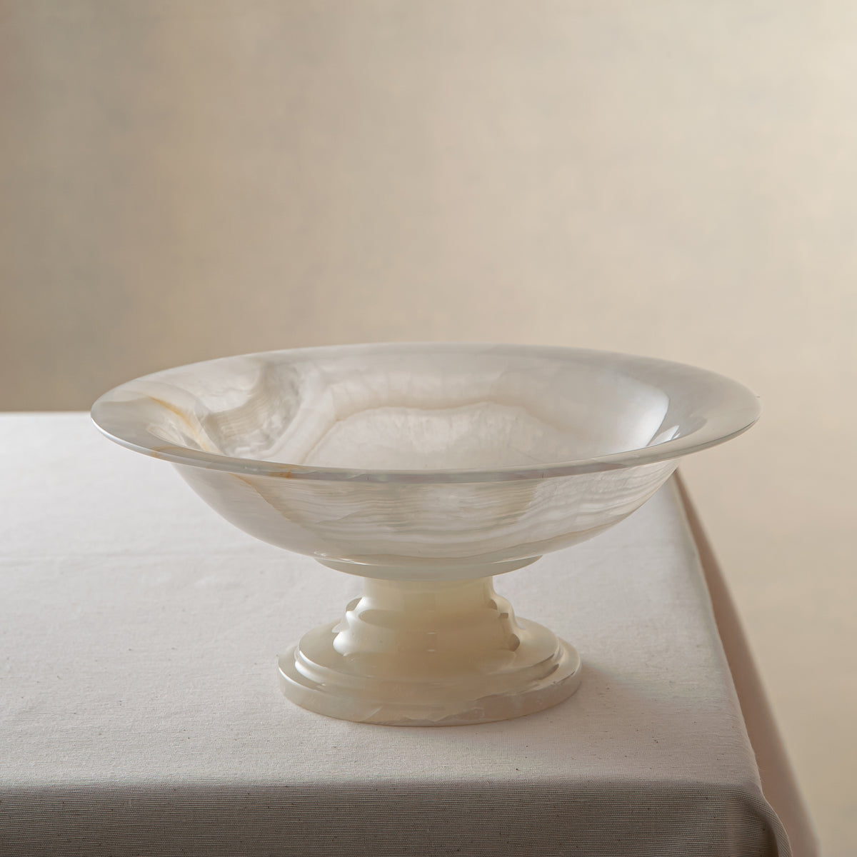 handcrafted onyx bowl with translucent ivory tones and natural veining for luxury table decor