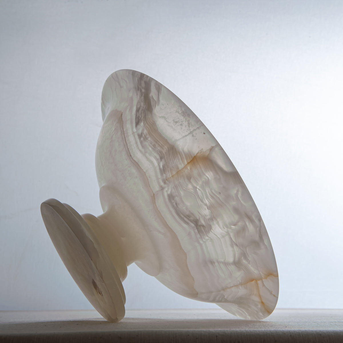 handcrafted onyx bowl with translucent ivory tones and natural veining for luxury table decor
